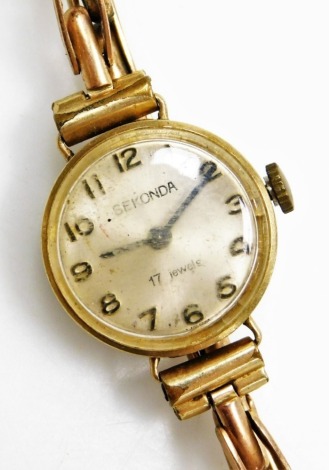 A Sekonda lady's 9ct gold cased wristwatch, circular silvered dial bearing Arabic numerals, on a rose gold plated strap.