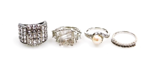 Four silver dress rings, comprising a cultured pearl and cz set twist ring, half hoop eternity ring, and two cluster rings, boxed. (4)