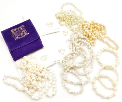 A group of pearl effect jewellery, comprising two necklaces, two cultured pearl necklaces, one pine, one cream, and three bracelets. (7)