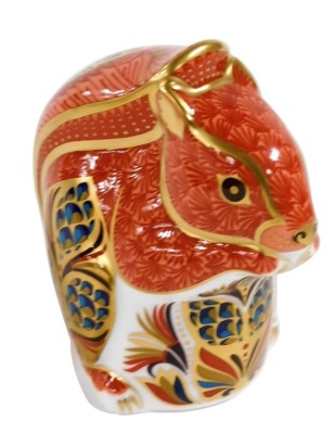 A Royal Crown Derby Imari porcelain paperweight, modelled as a red squirrel, printed marks, gold stopper.