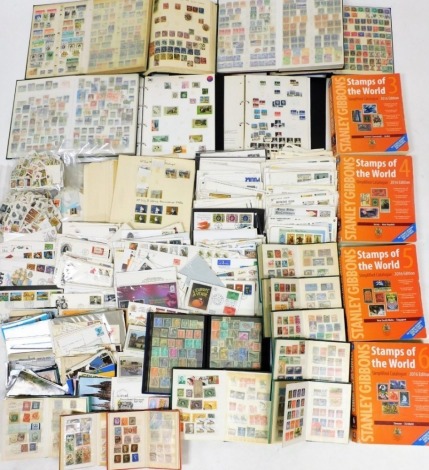 Various Stanley Gibbons Stamps of the World catalogues, first day covers, World, Great Britain and Commonwealth stamp albums. (2 boxes)