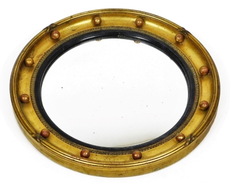 An early 20thC porthole mirror, of circular form, with a bead outline and moulded frame, 40cm diameter.