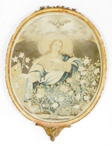 An early 19thC religious silk work embroidered panel, depicting the Virgin Mary among a flowering bush, 41cm x 34cm, in an ornate gilt wood frame, (AF).