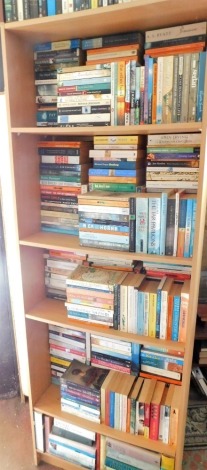 A quantity of general paperback and some hardback books, mainly novels to include Hornsby (Nick) About A Boy, Chatwin (Bruce) On The Black Hill, etc., lot to include a beech effect melamine bookcase. This lot is situated in 14 East St, Horncastle, LN9 6