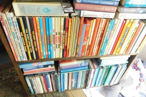 A large quantity of children's annuals, novels, etc., to include a section of Dr Who, Horrible Histories, Enid Blyton, etc, lot to include an oak open bookcase and a melamine bookcase. This lot is situated in 14 East St, Horncastle, LN9 6AZ for Viewing 