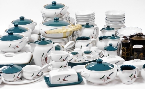 An extensive Denby pottery dinner service, decorated in the Green Wheat pattern, designed by A College, including tureens and covers, oval dishes, plates, bowls, condiments, jugs, butter dishes, etc.