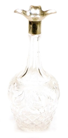 A George V cut glass decanter, with a silver collar with a quatrefoil flared rim, lacking stopper, Sheffield 1929, 28cm high.