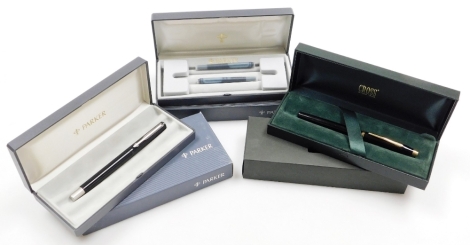 A Cross fountain pen, in black with gilt trim and gold coloured nib, boxed, and a Parker ball point pen, boxed.