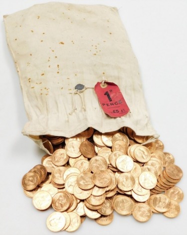 A bag of uncirculated pre-decimal one penny coins.