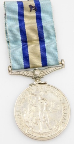 An Elizabeth II Royal Observer Corps medal, named to Observer Officer PC Holcombe.