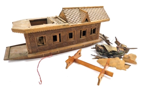 A vintage wooden scale model of an Indian riverboat, with carved decoration, and a fitted interior, 59.5cm wide.