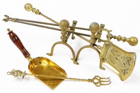 A quantity of brass, to include fireside implements, brass coal scoop with turned wooden handle, etc. (a quantity)