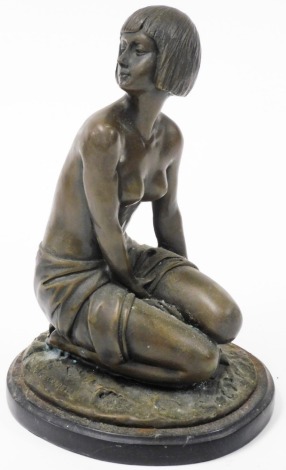 After Amadeo Gennarelli (French/Italian, 1881-1943). Bronzed figure of a semi clad lady, modelled in kneeling pose, raised on a naturalistic base, and oval black marble, 34cm high.