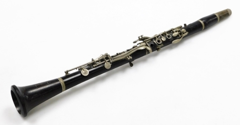 A Boosey & Hawkes Regent clarinet, number 51689, 67cm wide.