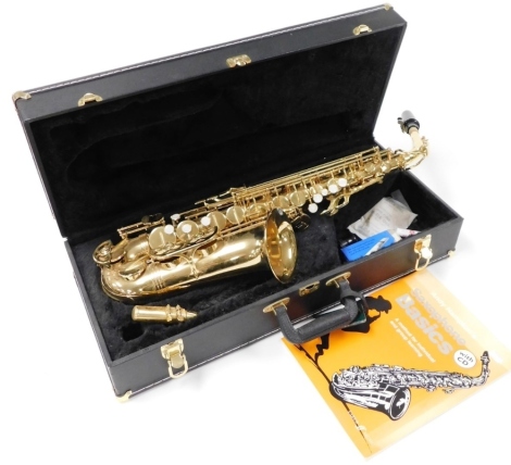 An Evette Buffet Crampon brass cased saxophone, ROC854625, cased, together with Andy Hampton's Saxophone Basics, with CD.