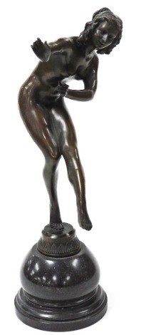 After Claire Colinet (French, 1880-1950). A bronze figure of the dancer, raised on a serpentine base, 47cm high.