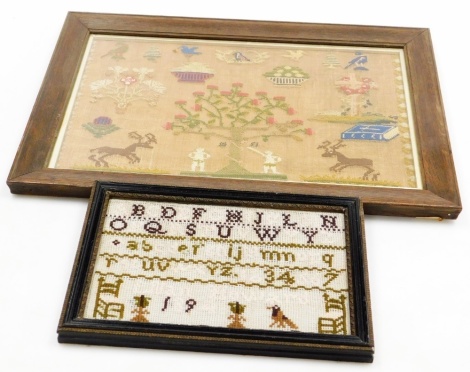 A Victorian woolwork sampler, stitched with Adam and Eve under the apple tree with the serpent, a Bible, cross draped with roses, birds, bowls of flowers and prancing deer, dated 1851, 28cm x 41cm, together with a late Victorian alphabet sampler by Lilian