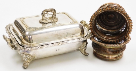 A Victorian silver plated entree dish cover, with crest and monogram engraved, 34cm wide, together with a pair of 19thC silver plated wine coasters. (3)