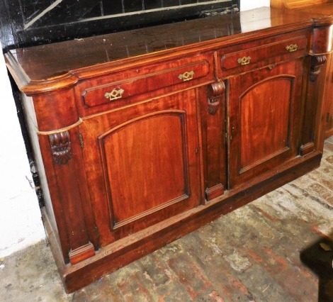 A Victorian mahogany sideboard, with two frieze drawers above two panelled doors, on a plinth, 90cm high, 152cm wide.