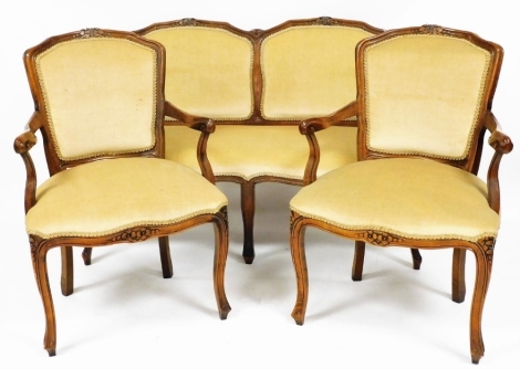 A reproduction Victorian mahogany salon suite, comprising a two seater sofa, 123cm wide, and a pair of armchairs. The upholstery in this lot does not comply with the 1988 (Fire & Fire Furnishing) Regulations, unless sold to a known exporter or upholstere