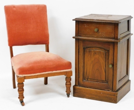 A Victorian walnut nursing chair, upholstered in red Draylon, raised on turned legs, together with a Continental mahogany pot cupboard, with single drawer over a panelled door, enclosing a single shelf, raised on a plinth base, 66cm high, 40cm wide, 37.5c