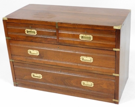 A mahogany military style chest, of two short above two long drawers, with recesses brass handles, raised on a plinth base, 69cm high, 103cm wide, 48cm deep.