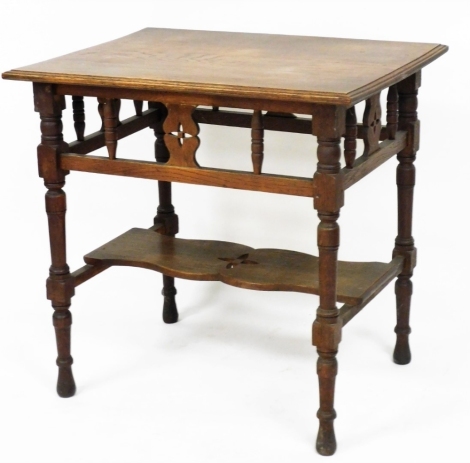 A Victorian oak side table, with a galleried frieze, raised on turned legs united by stretchers and a shaped under tier, 78cm high, 81cm wide, 61cm deep.