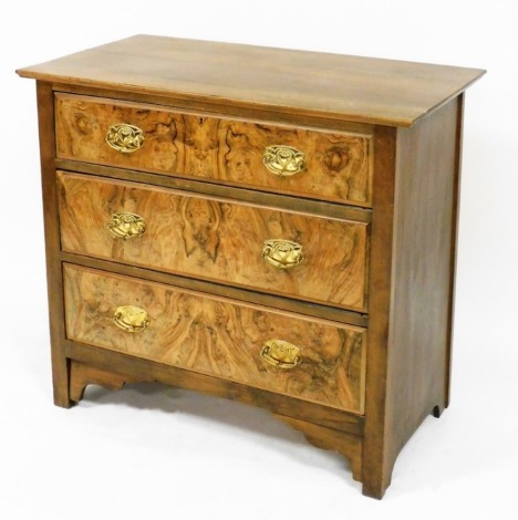 A Victorian mahogany and burr walnut chest, of three long graduated drawers, raised on stile feet, 82cm high, 91cm wide, 49cm deep.