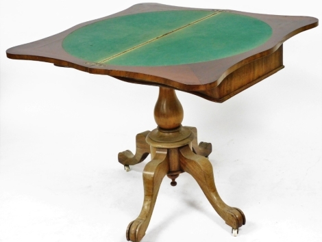 A late 19thC flame mahogany serpentine fold over card table, raised on a baluster turned column over four cabriole legs, brass capped on castors, 75cm high, 92cm wide, 45cm deep.