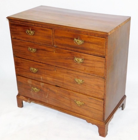 A George III mahogany chest, of two short over three long graduated drawers, raised on bracket feet, 106cm high, 109cm wide, 56.5cm deep.