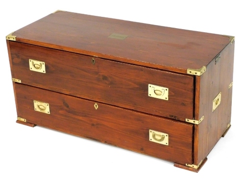 A stained pine tool chest, of two frieze drawers, with brass recessed handles, caps and name plate, engraved to P B Short, raised on block feet, 90cm wide.