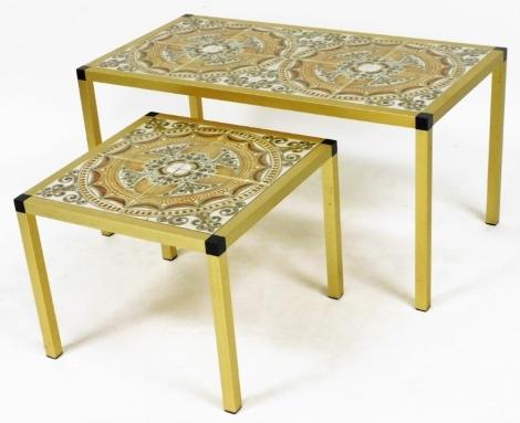 A mid century Danish brass and tile inset coffee table, of rectangular section, the top inset with eight tiles, raised on square legs, 53cm high, 85cm wide, 45cm deep, and a similar smaller table, 36cm high, 45cm wide, 45cm deep.