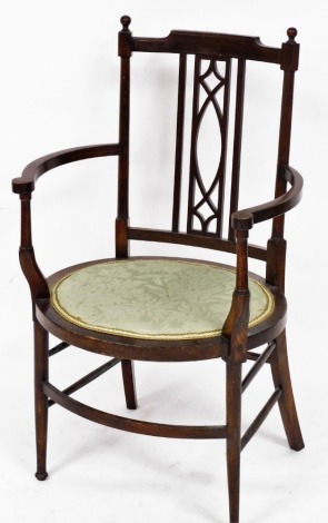 An Edwardian beech and line inlaid carver chair, with an oval seat, raised on turned legs.