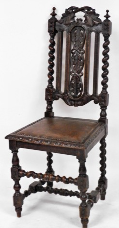 A Victorian 17thC style oak dining chair, the crest rail and splay carved with leaves, with studded leatherette seat, raised on turned legs united by a turned H framed stretcher.