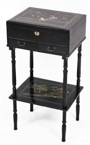 An early 20thC Japanese black lacquer vanity table, with gilt lacquered and mother of pearl inlaid decoration, the hinged lid opening to reveal a fitted interior, over two frieze drawers, raised on turned legs united by an under tier, 71cm high, 37cm wide