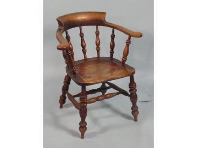 A 19thC ash smoker's bow or captain's chair with spindle turned arm supports