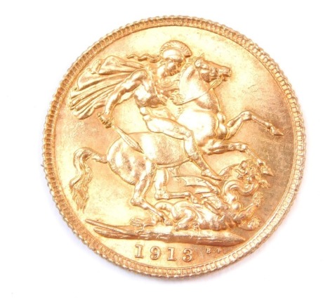 A George V full gold sovereign dated 1913.