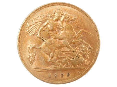 An Edward VII half gold sovereign dated 1909.