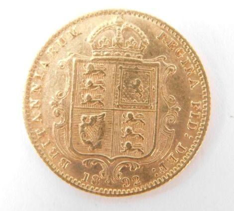 A Victorian half gold sovereign dated 1892.