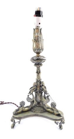 A Victorian EPNS table lamp, on tripod base, with raised decoration of putti and seahorses, converted from an epergne, 50cm high. WARNING! This lot contains untested or unsafe electrical items. It is supplied for scrap or re-conditioning only. TRADE ONLY