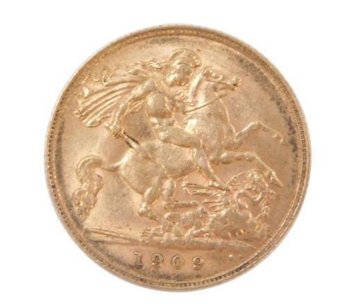 An Edward VII half gold sovereign dated 1909.