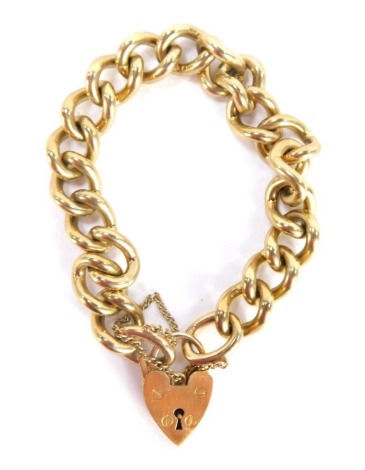 A 9ct gold gate bracelet, with heavy curb link chain, with safety chain and heart shaped clasp, 58.4g all in, 18cm long.