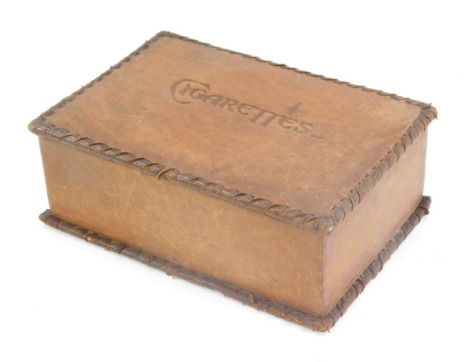 A brown leather cigarette box, inscribed Cigarettes, with bound edge, 15cm diameter.