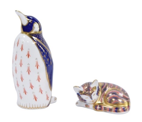 Two Royal Crown Derby animal paperweights, comprising penguin with silvered stopper, 13cm high, and seated tabby cat with gold stopper, 7.5cm wide. (2)