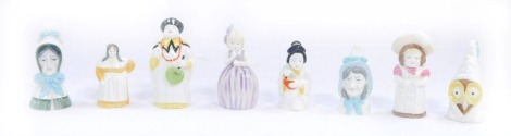 Eight Royal Worcester candle snuffers, comprising Japanese Girl, Owl, Feathered Hat, Mrs Caudle, Hush, Old Woman, Mandarin and French Cook. (8)