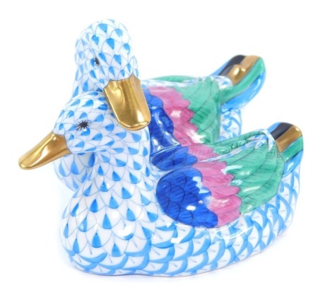 A Herend of Hungary porcelain duck group, in blue, purple and green painted decoration, with blue stamp to underside, 7cm high.