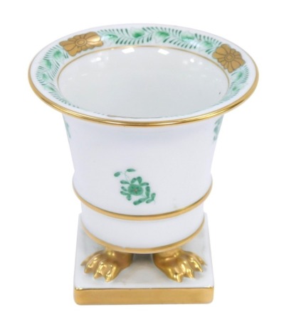 A Herend of Hungary miniature porcelain vase, with gilt borders and hand painted green sprays of flowers, on claw feet on a square base, with blue stamp to underside, 7.5cm high.