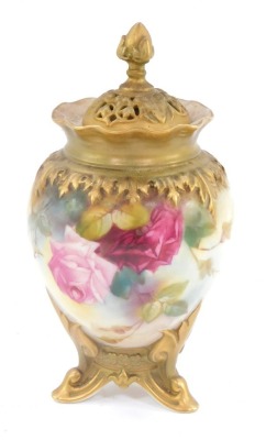 A late 19thC Royal Worcester jar and cover, with gilt lid with acorn finial and pierced design, with flared design border and hand painted rose decoration, signed PS Pilsbury, with purple stamp to underside 245, H15.54, 19cm high.