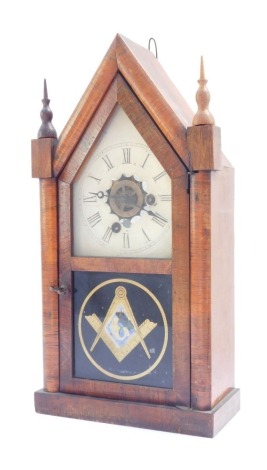 A late 19thC American rosewood cased mantel clock, of Masonic interest, the tin dial painted with Roman numerals, exposing a central brass wheel shaped chapter ring, 30 hour movement with bell strike, the case of Gothic architectural form with a glazed tw