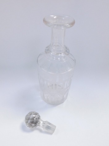 A Victorian cut glass decanter and stopper, etched with a banner 'Whisky 1' , in a surround of vines, 33.5cm high.